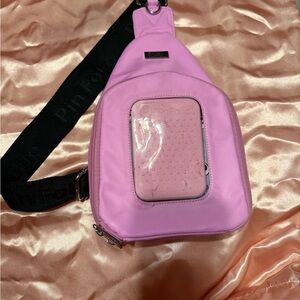 Pinfolio Pink Crossbody Bag with Black Strap